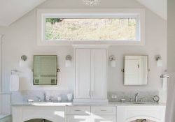 light bathroom design with double vanity with traditional details